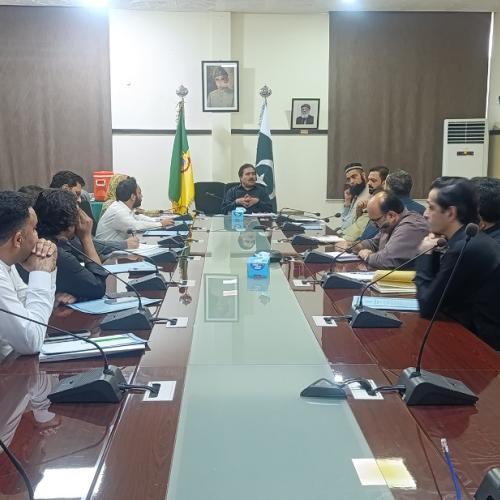 secretary in a meeting with tobacco companies